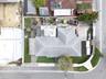 Aerial perspective of a corner lot property featuring a shingle roof, concrete driveway, perimeter fencing, and grass lawn