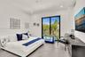 Room featuring large-format tile flooring, recessed lighting, and a black-framed sliding glass door providing egress to a private balcony
