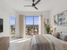 Virtually Staged Bedroom 2 with ensuite bath that includes walk in shower