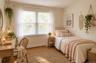 Neutral-toned room featuring wood-finish flooring and a double window
