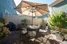 Just outside the Family Room, your private patio has room for gardens- you'll see an espaliered pear tree with grafted branches, each providing you a 