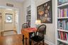 Looking toward the rear door, covered porch, patio, and 2-car garage.