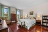 The elegance continues in the en suite primary bedroom.