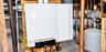 Wall-mounted Buderus heating system featuring copper piping, an expansion tank, and integrated digital controls