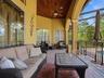 The architecture on the home is in every detail! Triple arches, wood plank tongue and grove ceilings!