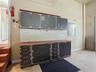 Workshop table and cabinets in the 3-car garage.