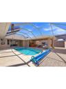 pool deck, bar and entertaining area with sliding doors to house and rv garage