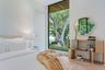 Floor-to-ceiling fixed window, wood-paneled ceiling accent, light-toned wood-finish flooring, and crisp white wall finishes