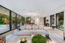 Living area featuring floor-to-ceiling glass sliding doors, wide-plank light wood-finish flooring, recessed lighting, and a modern multi-arm chandelie