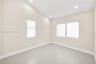 Vaulted ceilings featuring recessed lighting, large-format neutral tile flooring, and multiple windows with integrated blinds