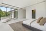 Floor-to-ceiling black-framed windows, recessed lighting, tray ceiling, and smooth-finish flooring