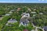 Aerial view of the property set among quiet, tree lined residential streets