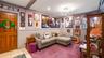 Guest bedroom with private entrance off the front of the home. Being used as a den/TV room