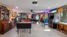 Main Home - Great room/kitchen/living room combo: Living room used as gathering space for game room fun. Two Sliders go out to covered back porch and 