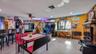 Main Home - Great room/kitchen/living room combo: Living room used as gathering space for game room fun. Two Sliders go out to covered back porch and 