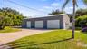 HUGE 30X75 Metal Building installed in October of 2022, has 6 large bay doors, some have electric openers. The completely paid off solar panels are lo