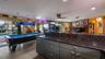 Main Home - Great room/kitchen/living room combo: Living room used as gathering space for game room fun. Two Sliders go out to covered back porch and 