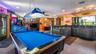 Main Home - Great room/kitchen/living room combo: Living room used as gathering space for game room fun. Two Sliders go out to covered back porch and 