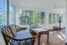 The two entrances meet in a huge wrap around sunroom!