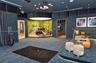 Custom media room featuring acoustical wall paneling, a recessed circular stage with integrated lighting, overhead projection system, elevated platfor