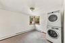 Freshly painted bedroom with stackable washer/dryer