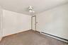 Freshly painted  bedroom featuring neutral wall-to-wall carpeting