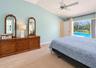 Primary bedroom leads to pool lanai