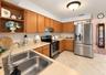 stainless sink over looks pool lanai