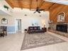 Family room with natural light and fireplace off 2nd and 3rd bedroom hallway