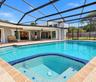 Screened Enclosed pool with spillover spa