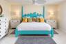 Neutral tile flooring and ceiling-mounted paddle fan with integrated light