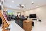 Spacious room featuring oversized large-format tile flooring, recessed lighting, a ceiling fan, and a wall-mounted ductless air conditioning unit