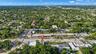 Aerial perspective highlighting a parcel situated in an urban area with immediate access to major thoroughfares and surrounding commercial infrastruct