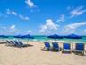 Direct beachfront access with expansive sandy shoreline and ocean waters