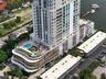 High-rise residential tower featuring a multi-level structure, wraparound balconies, an elevated swimming pool with a sprawling sun deck, and integrat