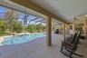 Covered porch area leading out from primary bedroom is approximately 35x15 ft.