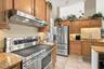 Stainless appliances, and range has a side convection oven.