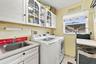 Interior laundry with storage.