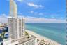 High-rise exterior architecture with expansive coastal and ocean scenery