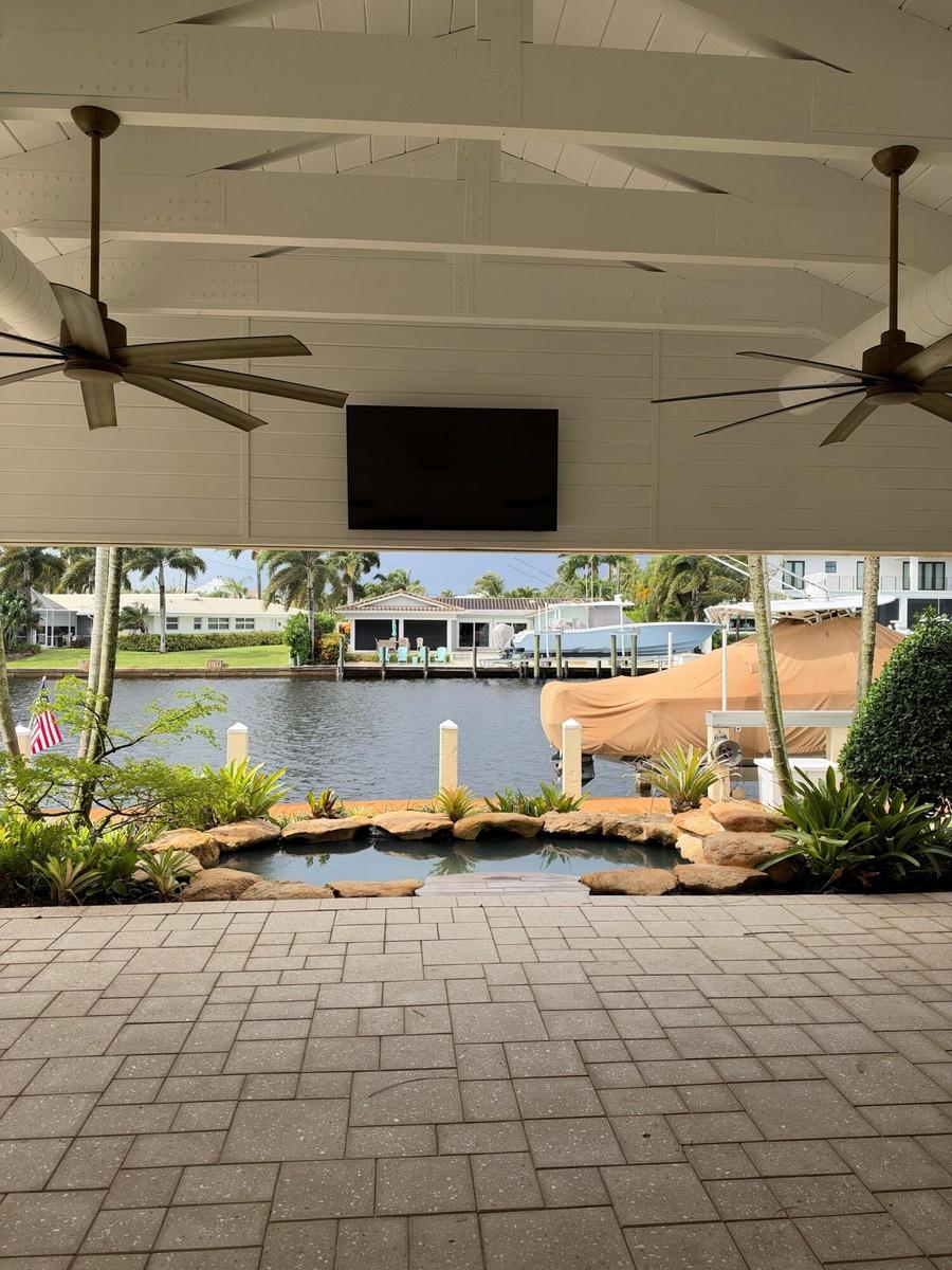 Patio with TV, roll down screens and air conditioning