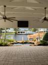 Patio with TV, roll down screens and air conditioning