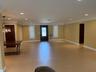 Rich mahogany entry with decorative glass and natural light.