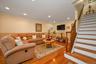 Large Living room With beautiful hardwood floors, recess lighting.