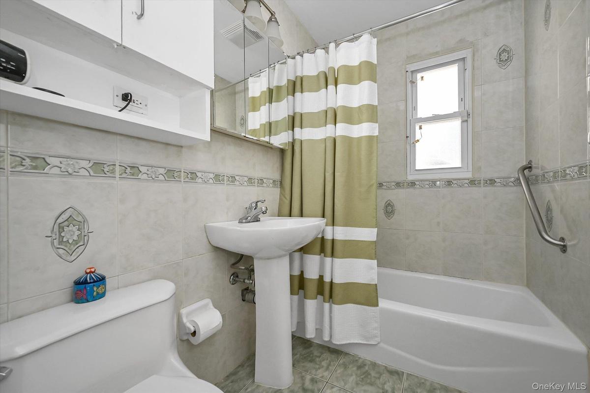 First Floor Full Bathroom, with tub and shower.