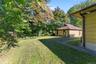 Backyard with door to kitchen and door to lower level