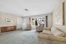 Entry to home with coat closet in spacious living room