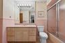 Bathroom with door to primary bedroom and hallway