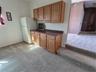 Mini kitchen area, plumbeb for future sink