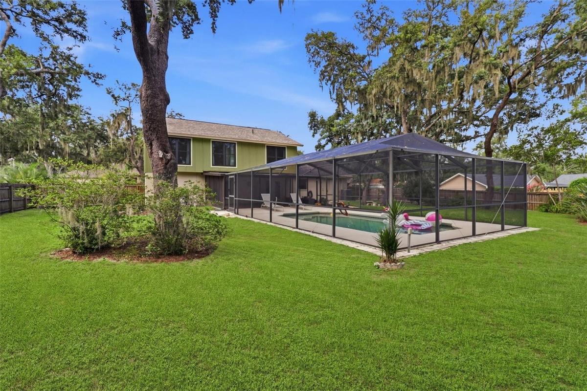 Large corner lot home with pool and LOTS of yard, fully fenced.