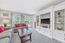 Den with Built-In Entertainment Center, Slider, Open to Kitchen and Entry Foyer